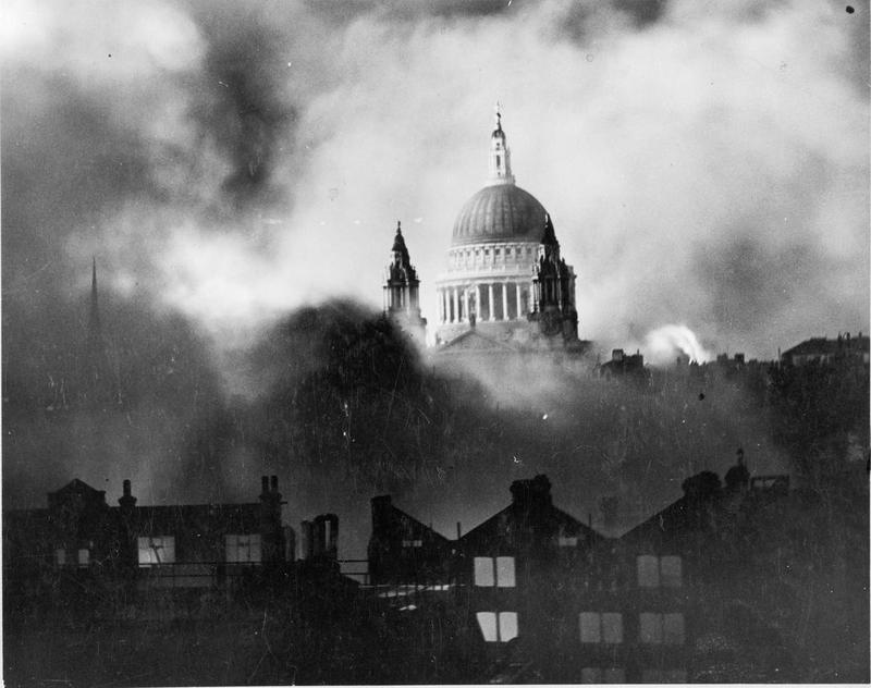 WWII picture of burning buildings in the foreground and St Paul's Cathedral rising out the smoke unharmed in the background